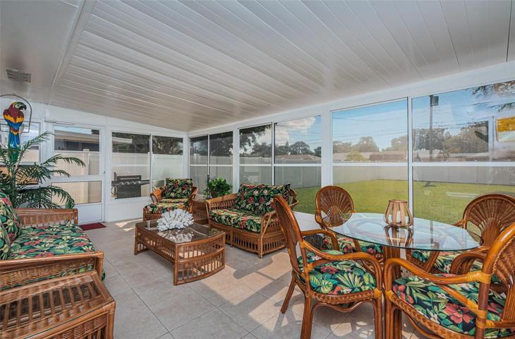 Florida Room with vinyl windows and wall unit AC adds bonus living space.