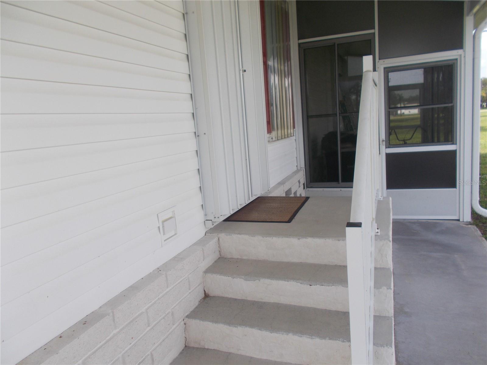 Entrance showing hurricane shutter for door