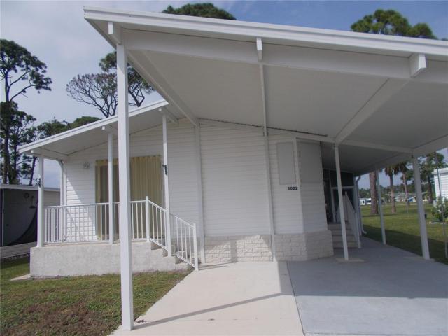 Front of Home showing 2 parking spaces