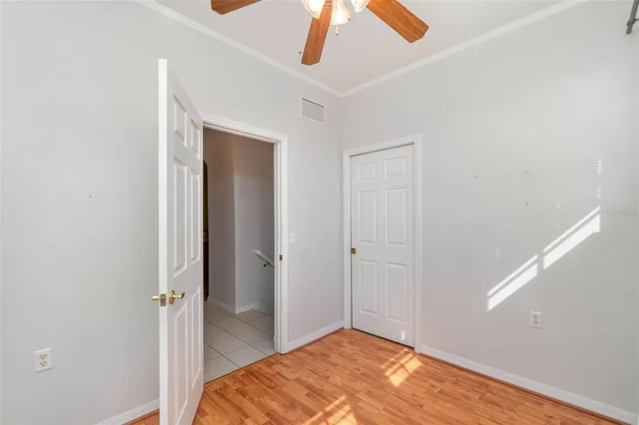 The den is ideal for use as a home office or a third bedroom, with the added convenience of access to the laundry room.