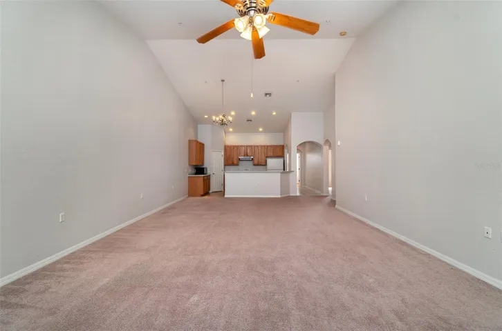 Perspective from the living area, seamlessly transitioning into the dining space and kitchen.