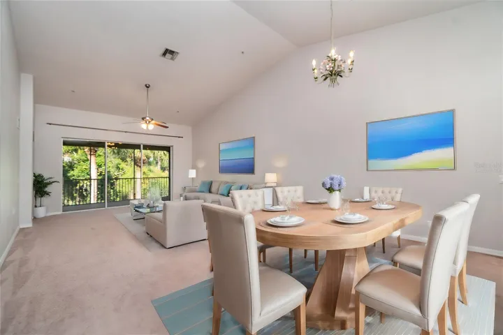 Virtually StagedLarge sliding glass doors usher in abundant natural light, complemented by the expansive height of the ceilings.