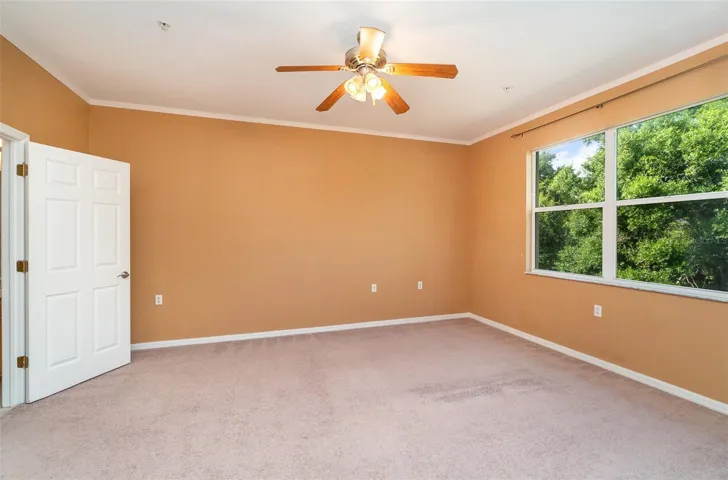 Spacious Primary bedroom featuring private views that overlook the preserve.