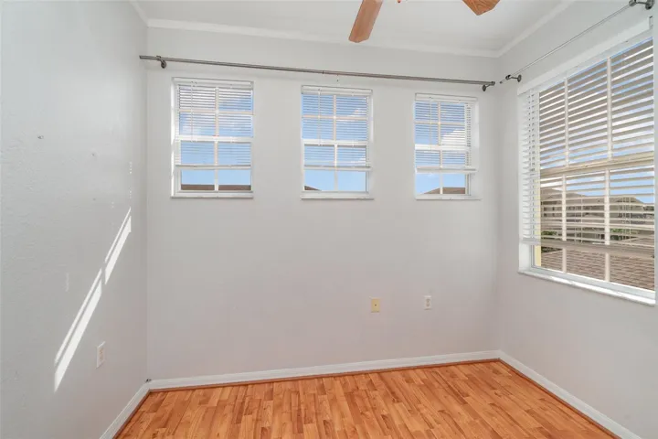 The den is ideal for use as a home office or a third bedroom, with the added convenience of access to the laundry room.
