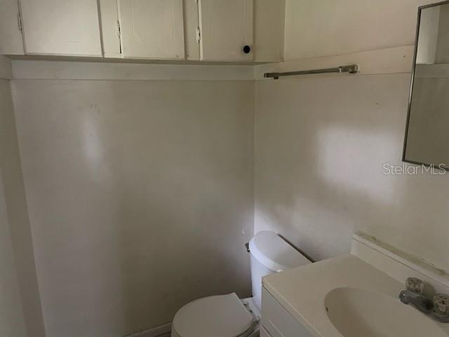Half bathroom in primary bedroom