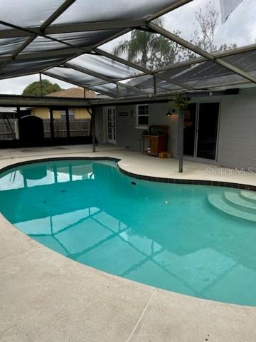 covered area off pool for outdoor dining poolside if you like