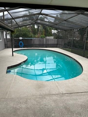 pool area is screened in and just of the kitchen for easy entertaining