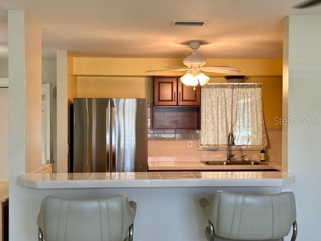 Pass through from kitchen into both living room and bonus room