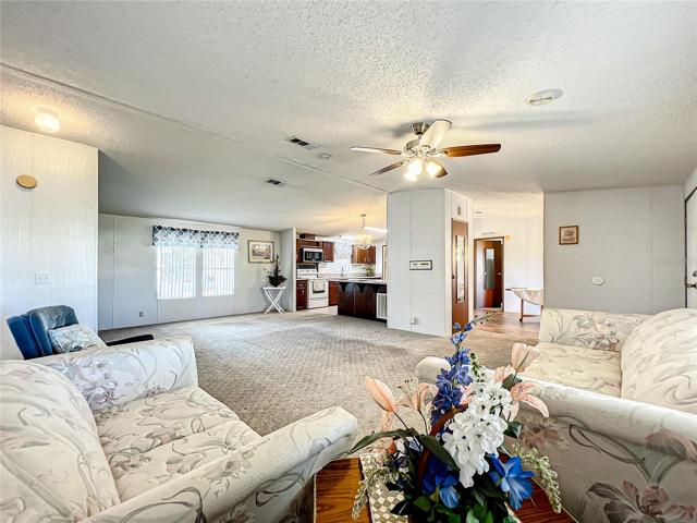 View from the living room into the kitchen and dining room