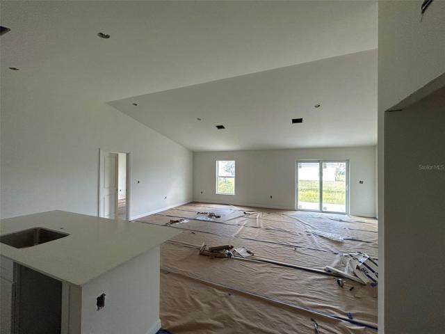 open floor plan with kitchen and great room (actual house under construction)
