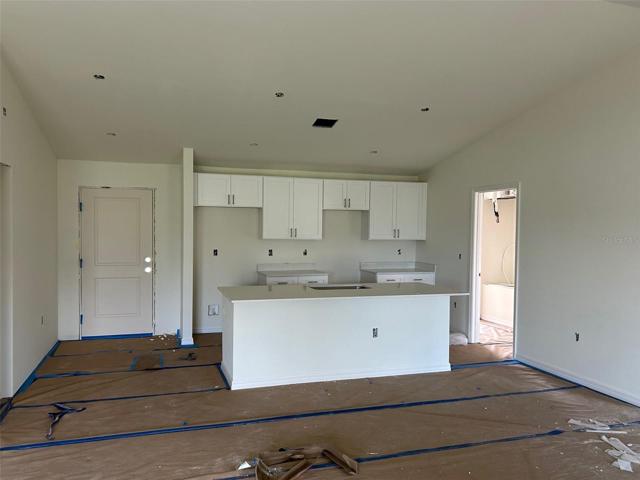 open floor plan with kitchen and great room (actual house under construction)