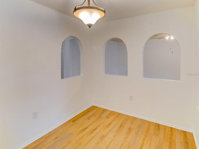 Dining room with new wood laminate flooring.