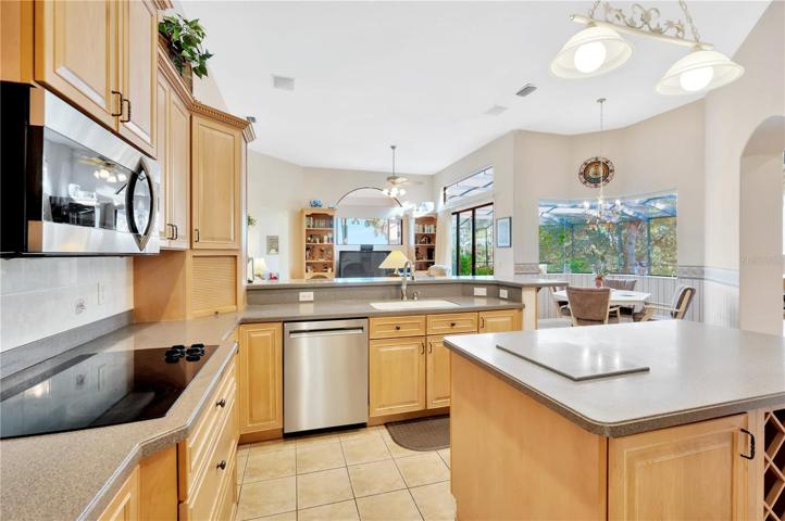Kitchen opens to the grand living area.