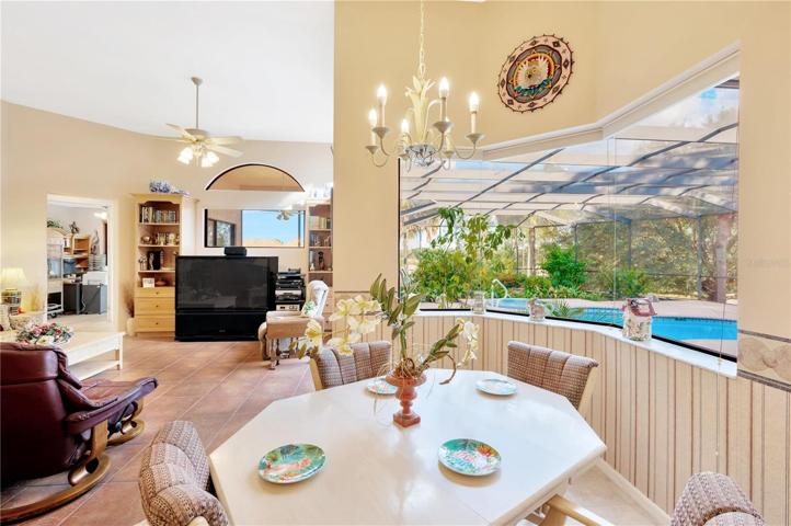 Breakfast nook area with lanai and pool views