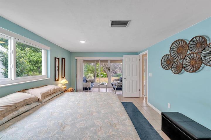 Primary Bedroom with sliders to the patio