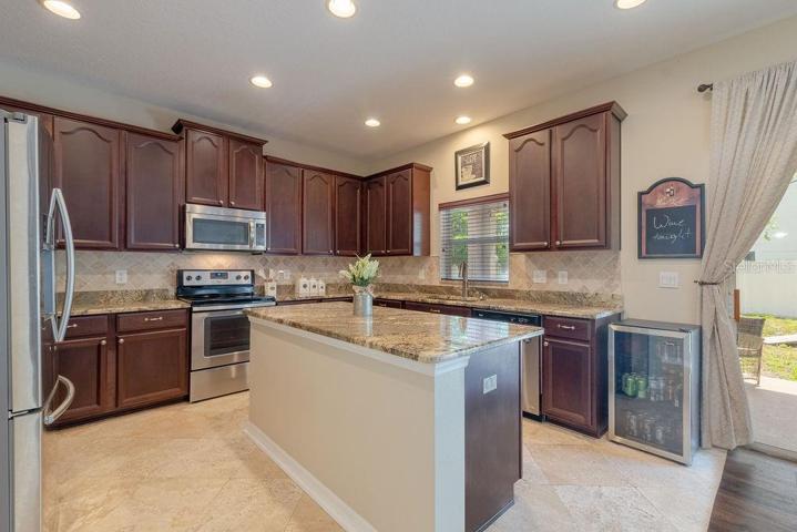 A chef's delight - all stainless steel appliances, French door refrigerator, and an island for the biggest feasts
