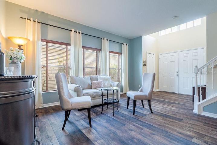 Formal sitting room with large window front