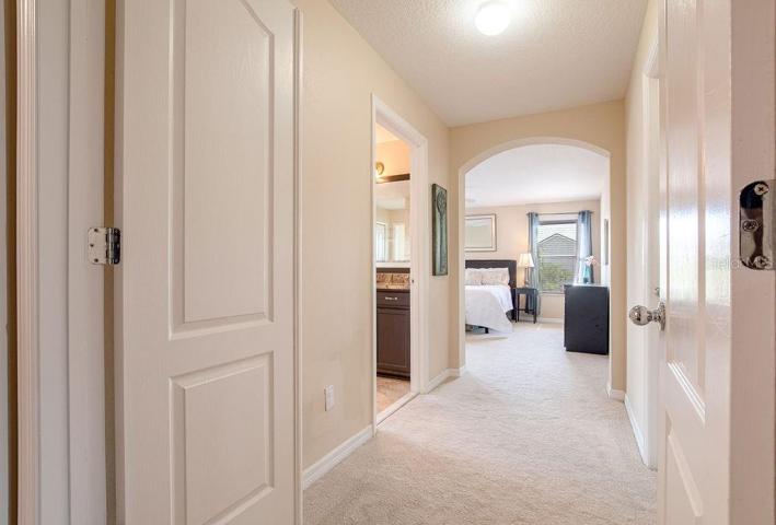 The main bedrooms welcomes you with double doors and his and hers closets to either side