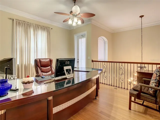 10549 Cory Lake Dr, second floor loft with wrought iron railing. Overlooks entry hall below