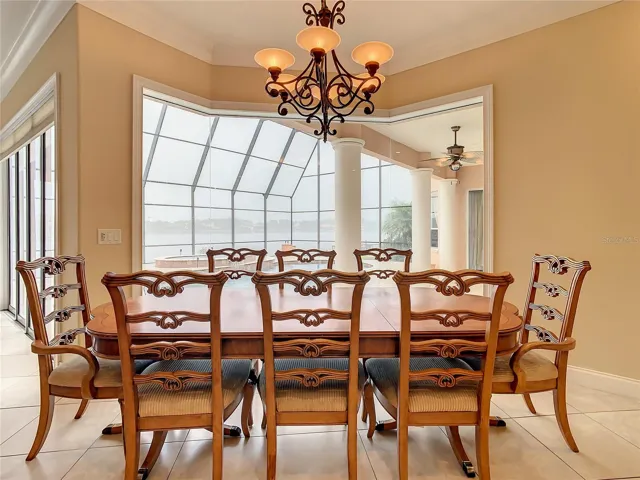 10549 Cory Lake Dr, casual dining area, view of pool and lake