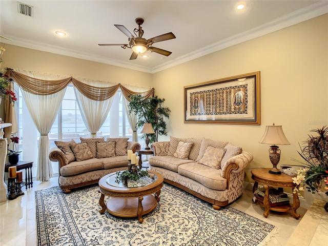 10549 Cory Lake Dr, formal living room, view of pool and lake