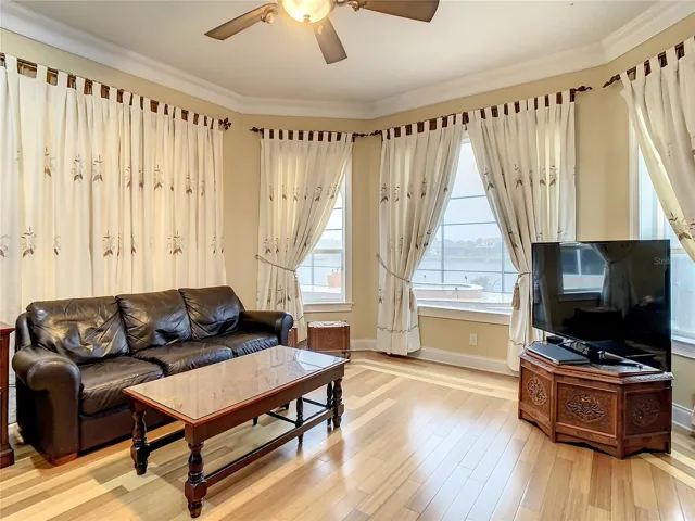 10549 Cory Lake Dr, ground floor owner's suite, sitting area, view of pool and lake