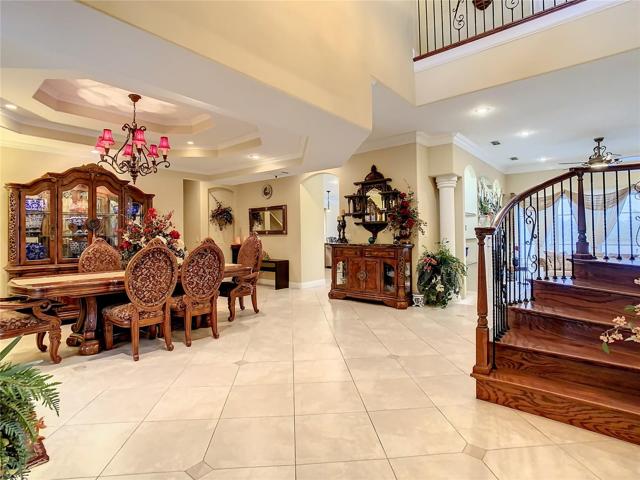 10549 Cory Lake Dr, entry hall, travertine tile floors, view toward dining area