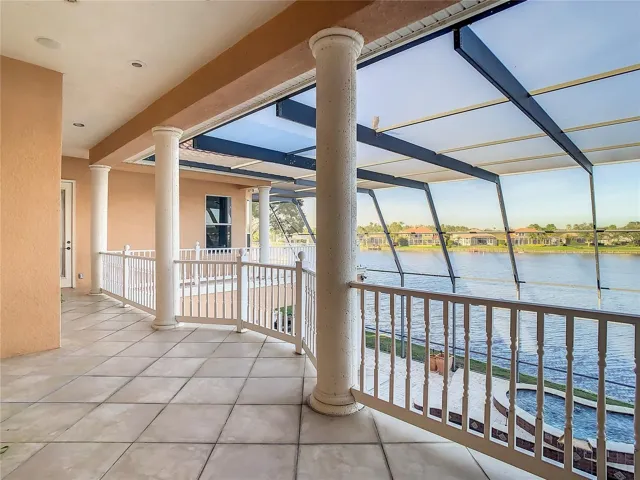 10549 Cory Lake Dr view of pool and lake from 2nd floor gallery