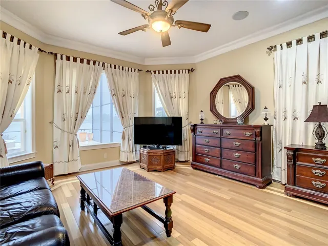 10549 Cory Lake Dr, ground floor owner's suite sitting area, view of pool and lake