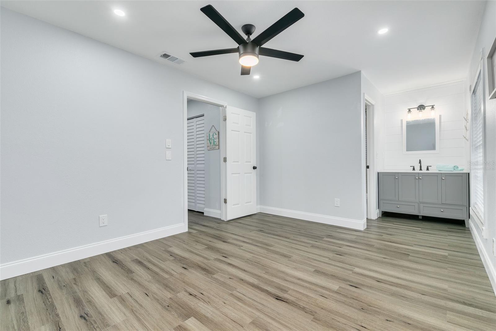 VIRTUALLY STAGED Second bedroom with sink
