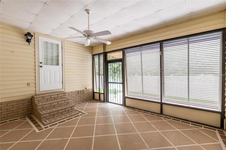 Rear Courtyard covered area to back porch -- Master and 3rd bedroom are attached to get in