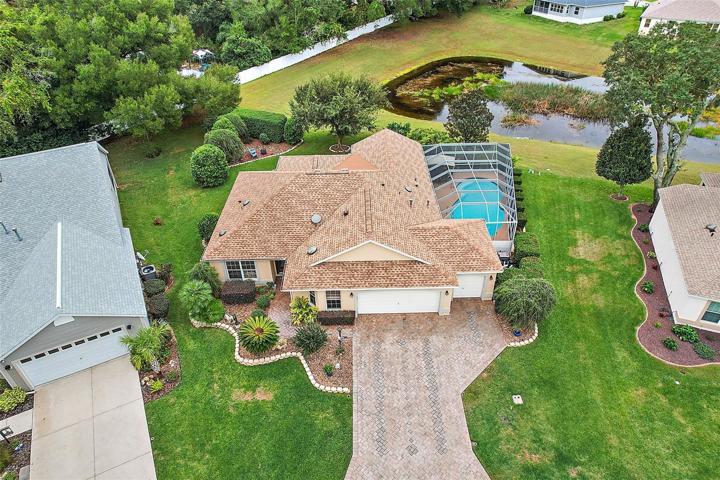 Fabulous 3/2 Dogwood/Jasmine with Seasonal Water View, with Spectacular Outdoor Living Space with Pool, Spa, Firepit, Patio on oversized lot.