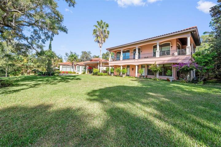 Back view of second building with garage, wine tower, casita and upstairs mother in law with large wrap around balcony!!  Stunning ...