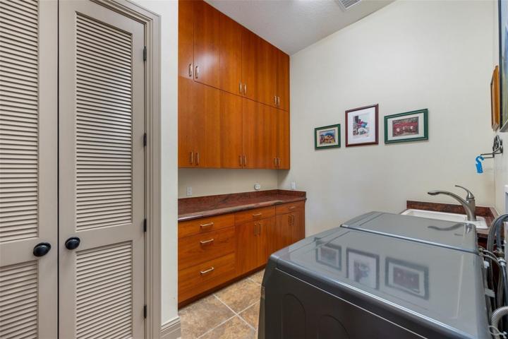 Laundry room with sink, closet, very spacious near the master bedroom !