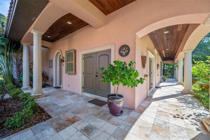 Double door to one of storages, left door to wine tower and upstairs unit, right walkway to storage, pool bath and casita!