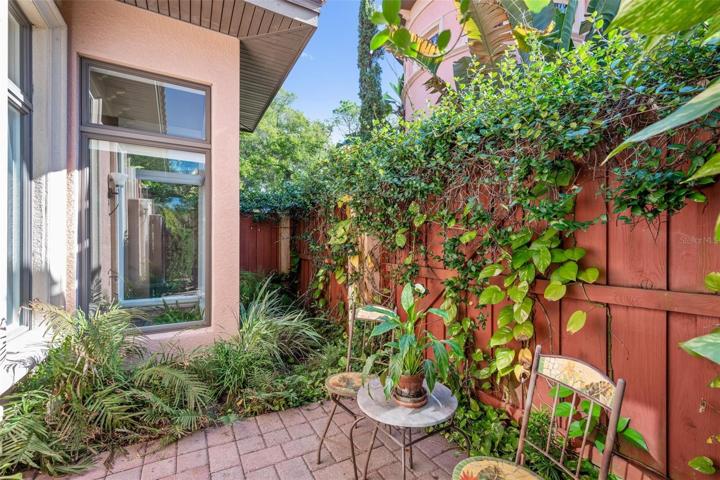 master bedroom outdoor sitting area with plenty of windows even in the large shower!