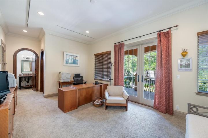 Upstairs second bedroom with exit to the front balcony and door to bathroom!