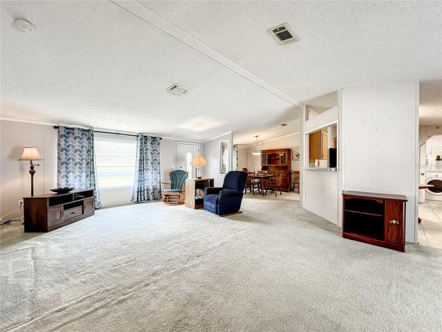 Living room with view into the dining room