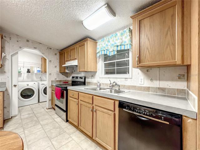 Kitchen and view into the laundry room