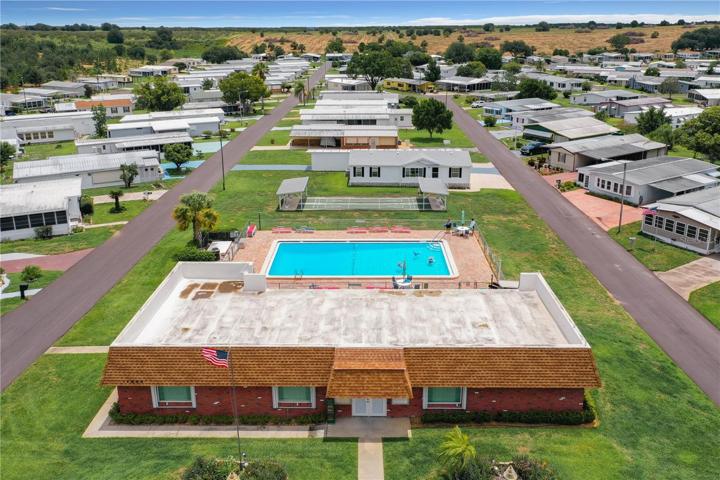 Aerial of the pool, clubhouse and shuffleboard