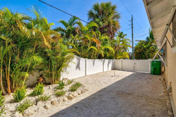 Side yard is fenced off with gate