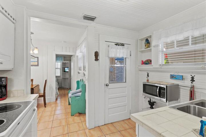 Door leading from kitchen to backyard