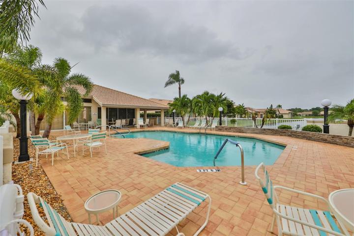 Nice pool area in this smaller all tile roof neighborhood
