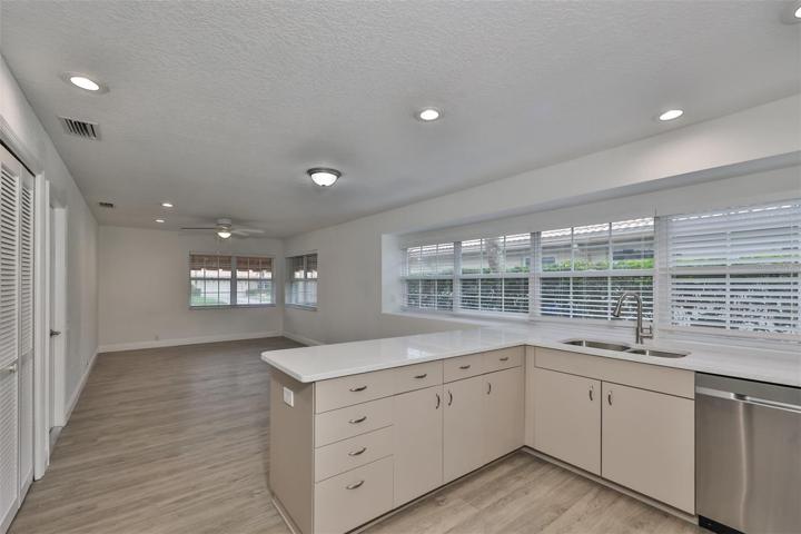 kitchen area with lots of windows