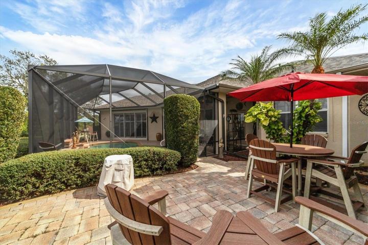 Walk out the side screen door of the cage to this awesome patio for more entertaining area and fun!