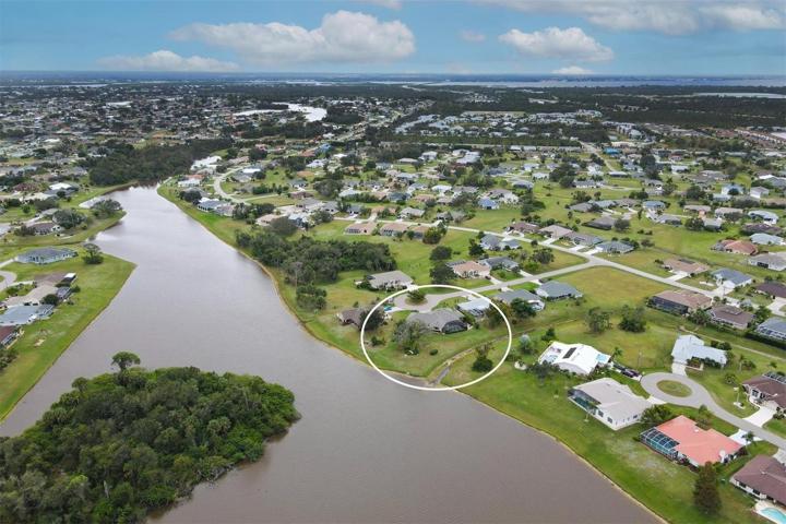 aerial of partial lake and home