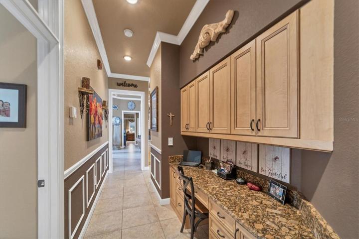 tucked away and not seen in previous picture built in desk and cabinetry - no wasted space here!