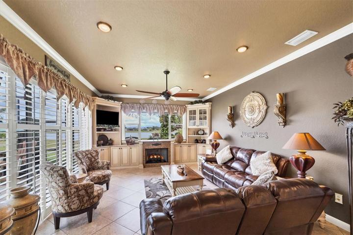 wall of sliders to your left, built ins and remote fireplace (propane) underneath the window that gives that tremendous view of the lake