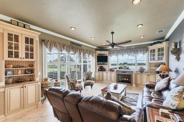 view of family room from kitchen - plenty of storage spots here, all in the right places in this home
