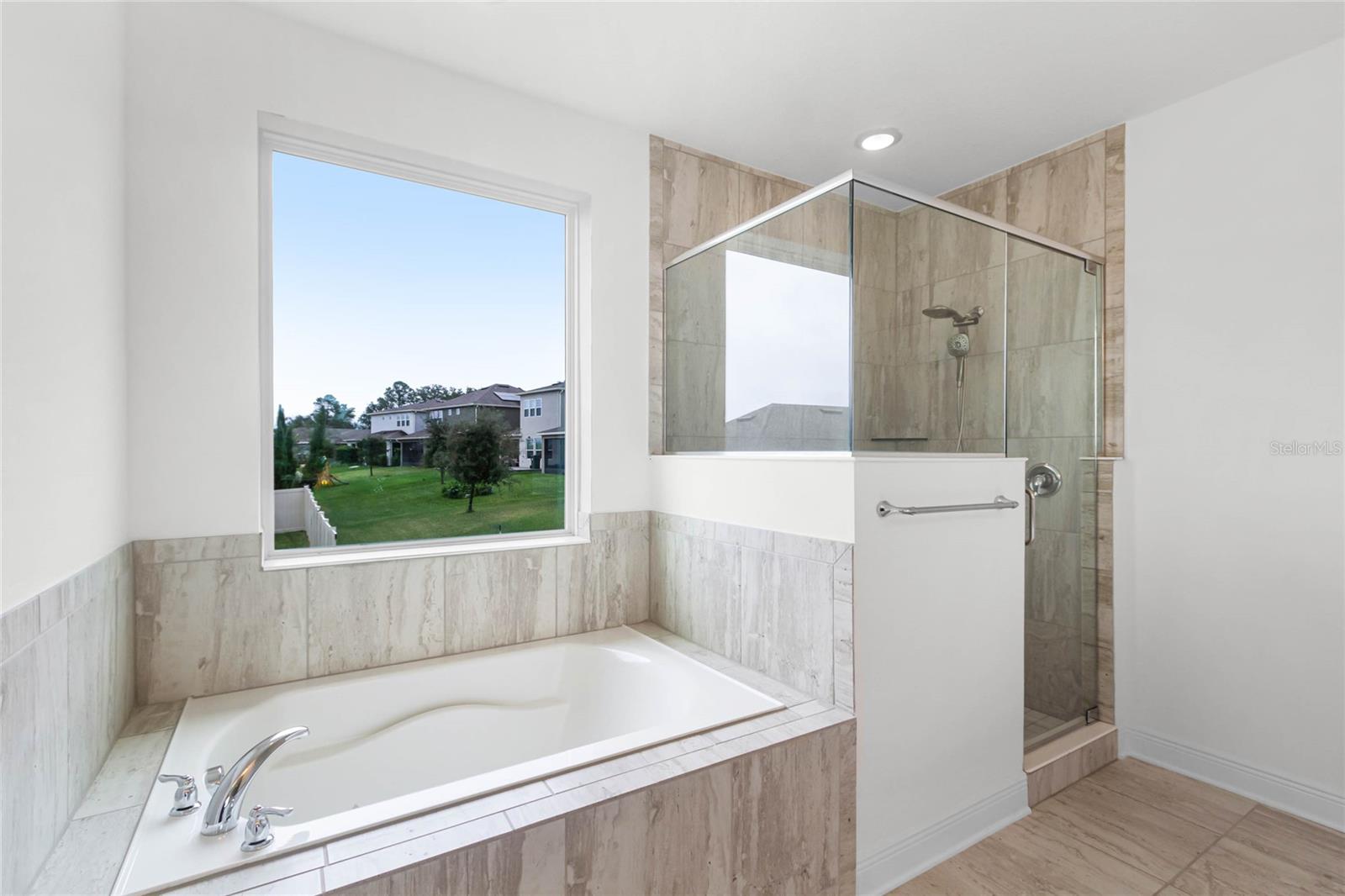 There is a soaking tub and a walk-in shower.